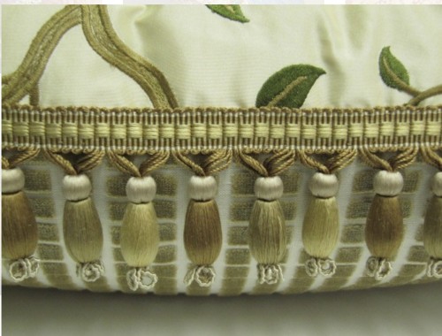 Hand sewn drop tassels along the seam, showing the decorative heading.